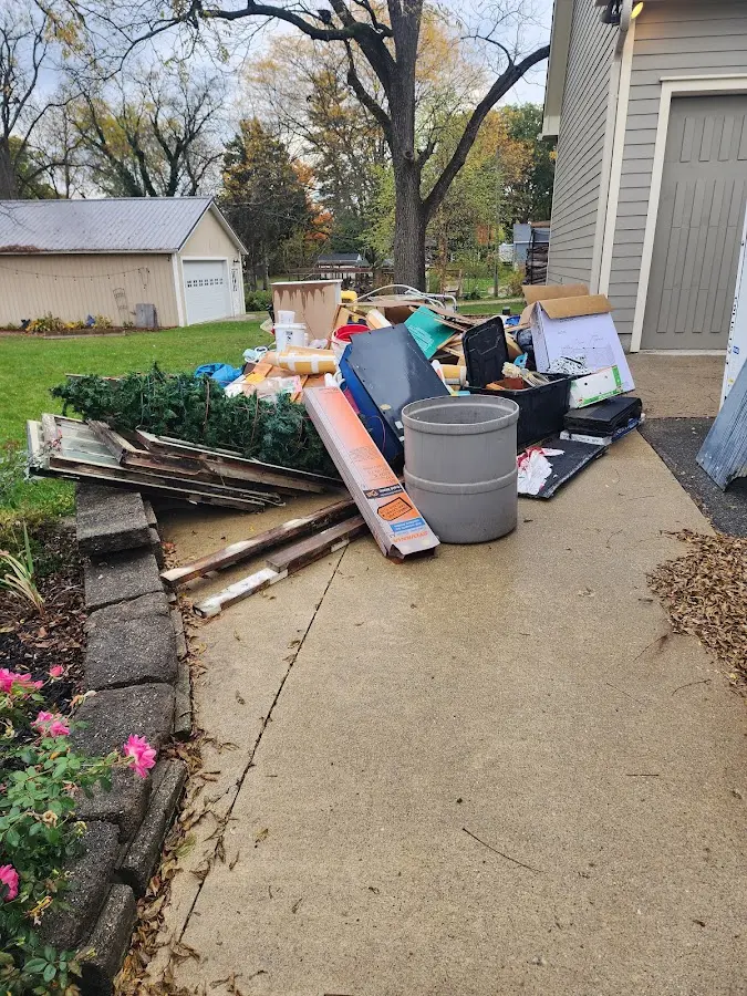 Dumpster being loaded with debris for Residential Dumpster Rental in Seaside Park